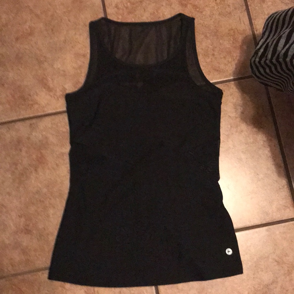 Black top with mesh on top and on back